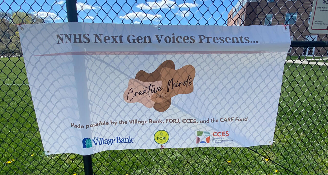 Attendees are welcomed by a poster thanking this year's sponsors.