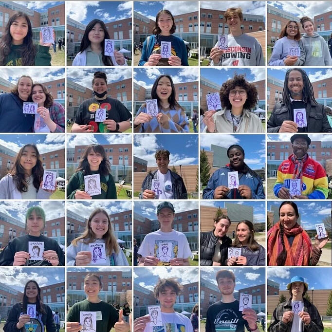 These attendees are all smiles while posing with their beautiful caricatures!