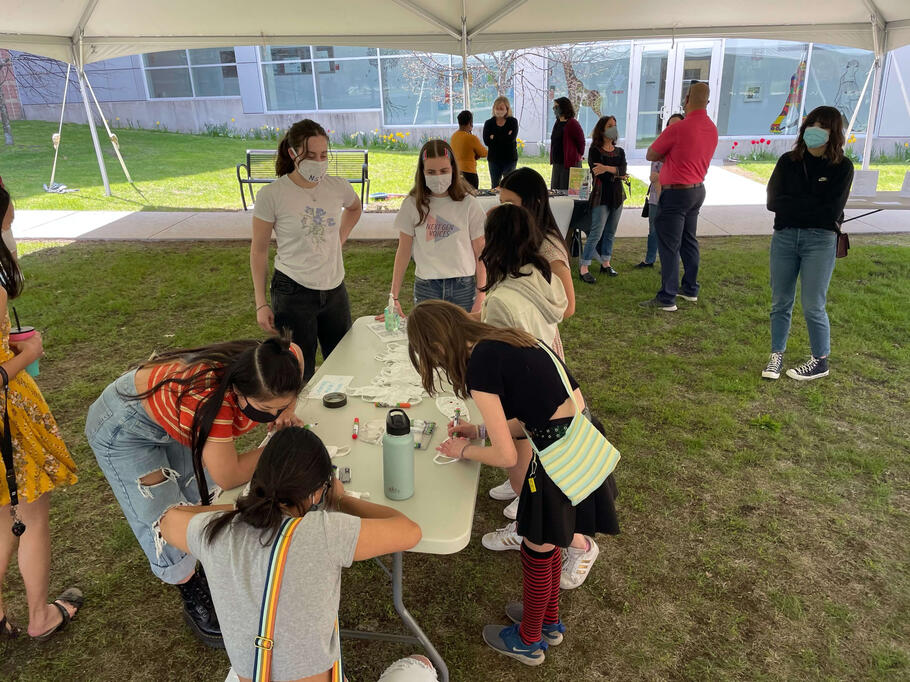 Attendees create their own art decorating masks