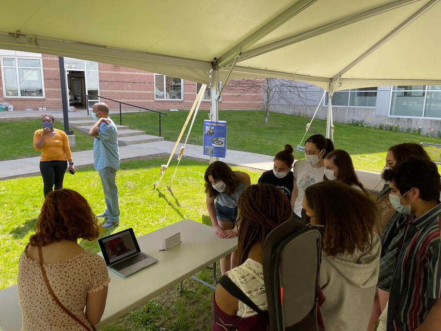Attendees watch a video from Destiny Palmer, one of our featured artists