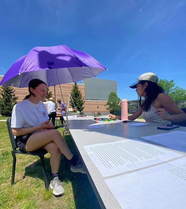 Student artist Abby Puduseril drawing caricatures.