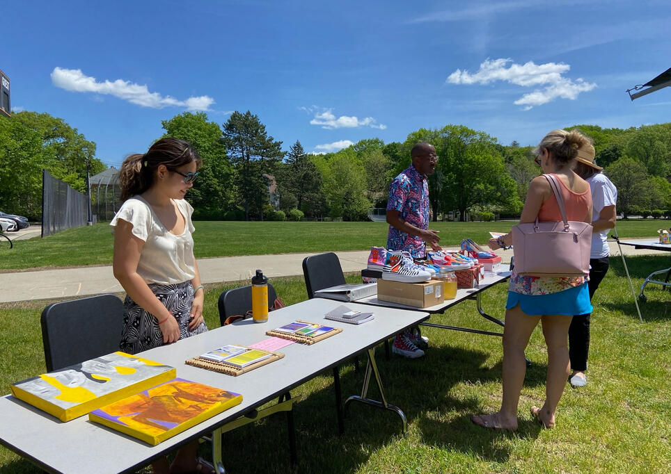 Professional artists Tran and Jamaal talking with event-goers.